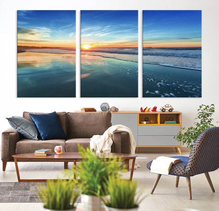 The Blue Sky and Beach Wall Art Canvas Print features a vibrant orange sky reflecting on wet sand.