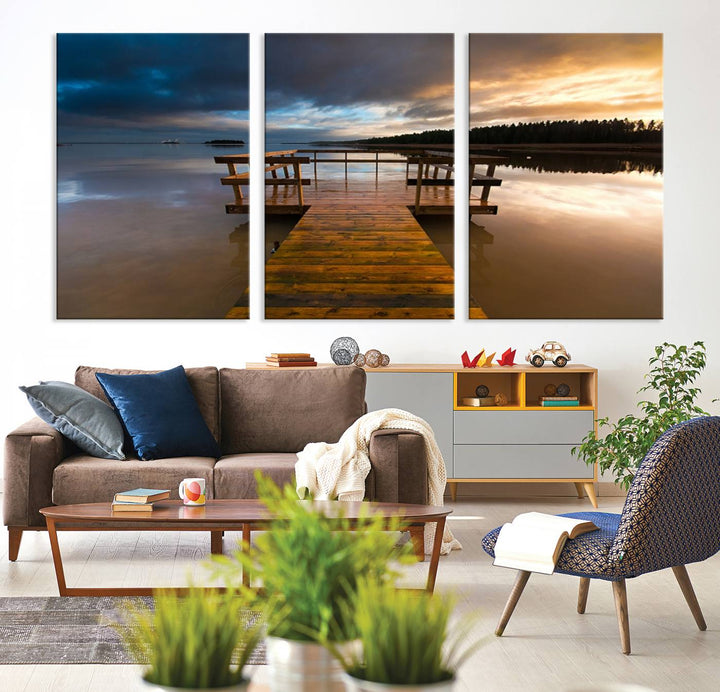 The "Serene Lake Pier at Sunset" landscape canvas print, crafted as ready-to-hang and framed wall art, enriches the contemporary setting by capturing the tranquility of a lakeside pier at sunset.