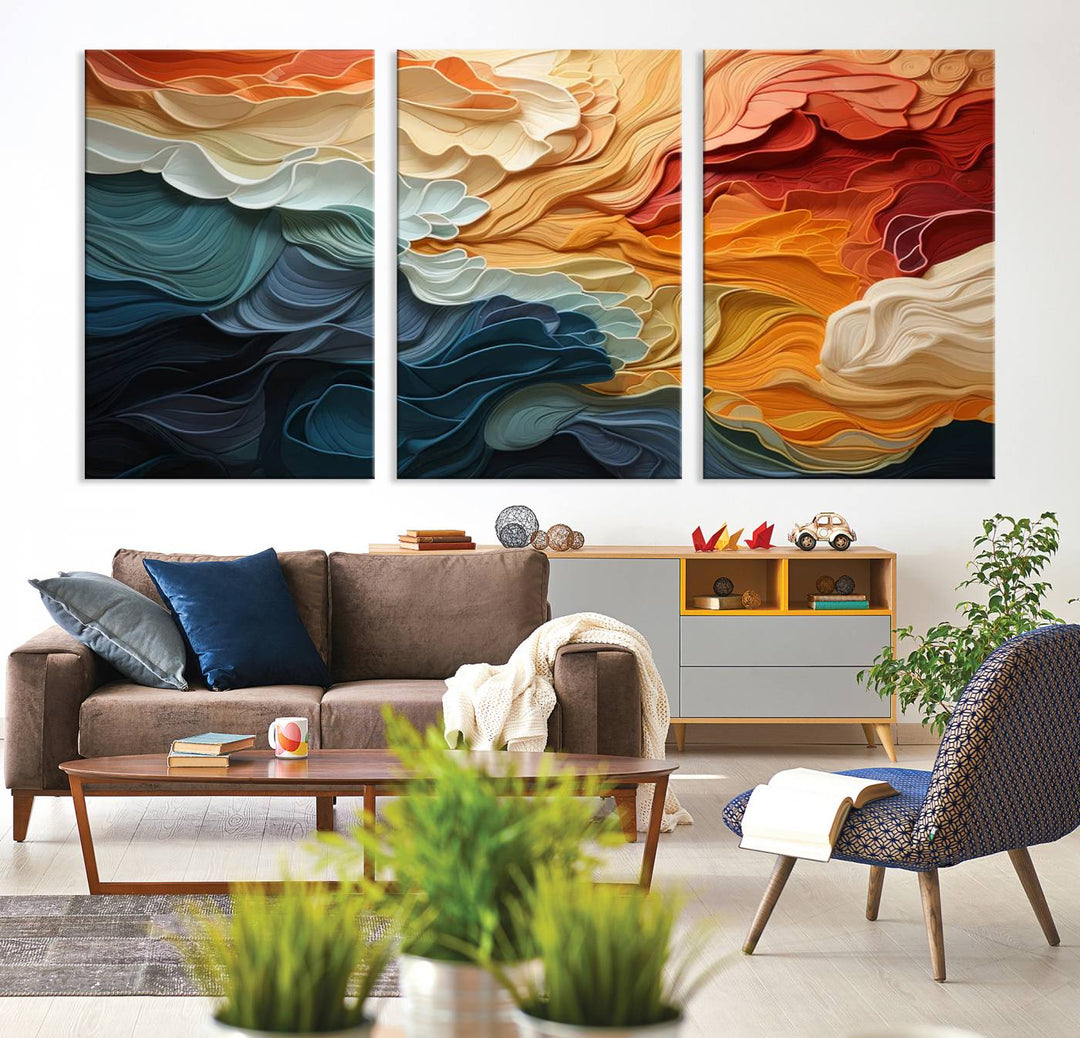 A Blue Orange Abstract Wave Wall Art Canvas Print adorns the wall. This colorful masterpiece is professionally hand-assembled to enhance any space.