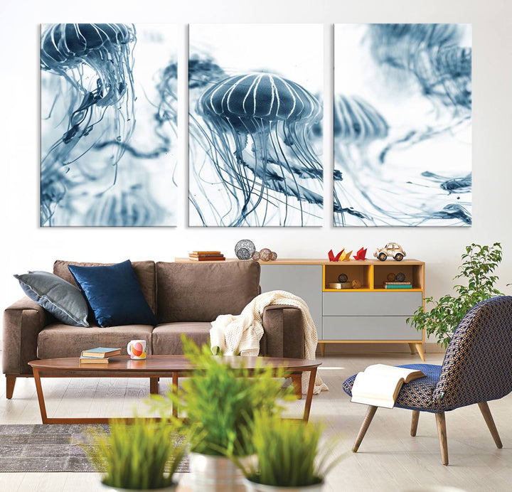 The "Abstract Jellyfish Wall Art Canvas Print" in high resolution is beautifully displayed as a triptych on a dark wall. Experience museum-quality canvas and enjoy free shipping with this stunning piece.