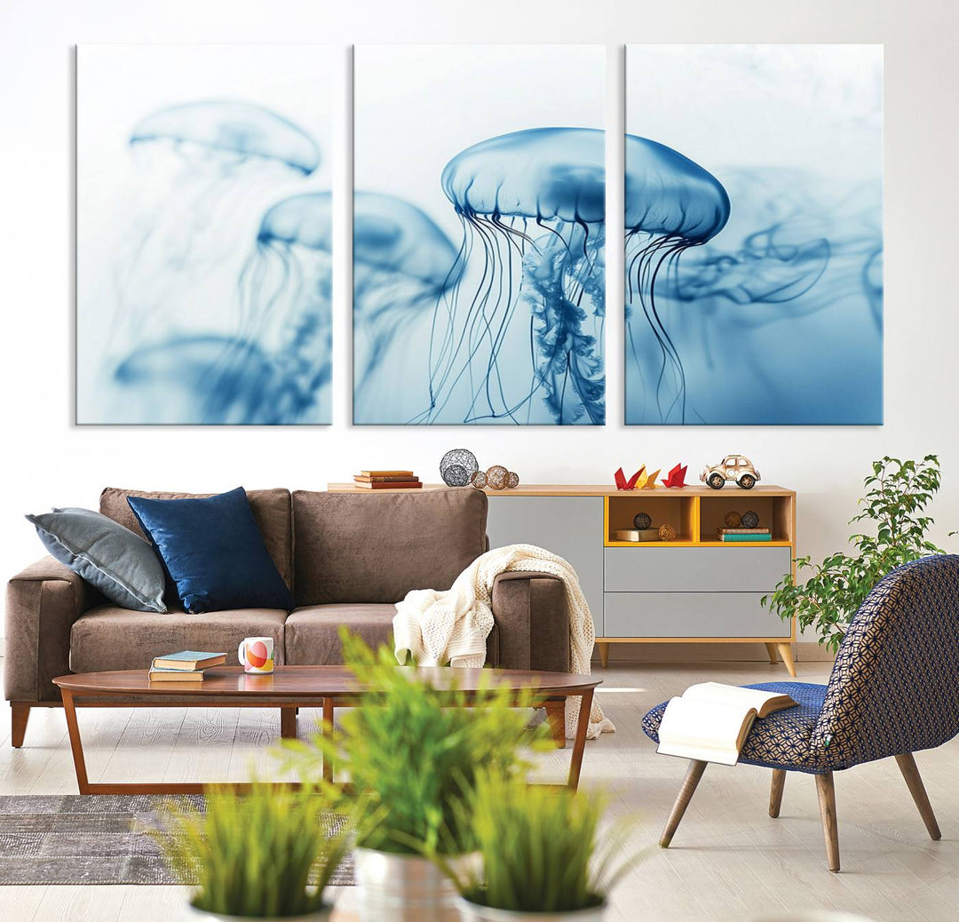 A breathtaking triptych of the Blue Jellyfish Wall Art Canvas Print decorates the space, beautifully highlighted by an overhead lamp. Each canvas is created on museum-quality material using high-resolution printing and includes a UV-protective coating to ensure long-lasting vibrancy.