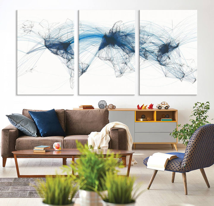 The Aviation Flight Map Wall Art is a set of three abstract panels featuring a world map with blue lines, resembling a flight map. Ideal for aviation enthusiasts, this ready-to-hang framed air traffic art print enhances the appeal of modern decor.