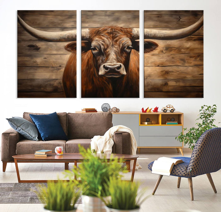 The Longhorn Bull Wall Art, a ready-to-hang canvas print, showcases an image of a brown longhorn cow set against a wooden background, perfect for those looking to enhance their space with rustic farmhouse and western barn decor.