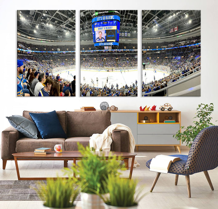 Wall art prints depicting the bustling scenes of the St. Louis Blues being cheered on by a full house at the Enterprise Center, beneath a large scoreboard.