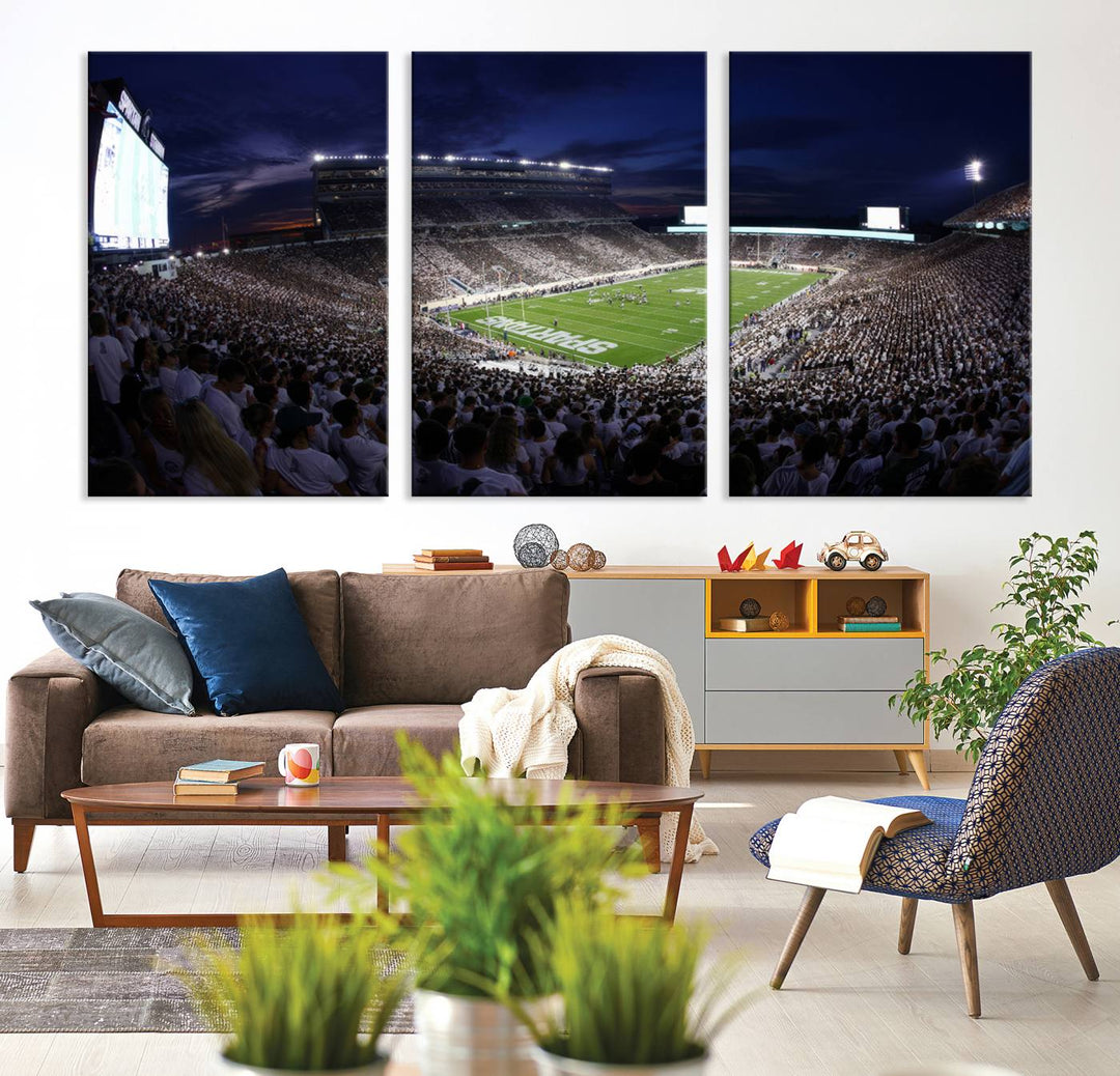 A packed football stadium at night, with bright lights and fans in white, depicted in a Michigan State Spartans Stadium wall art.