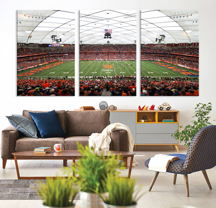 Fans fill the Syracuse JMA Wireless Dome, highlighted in orange and blue under a vaulted roof on this premium canvas print of the scene.