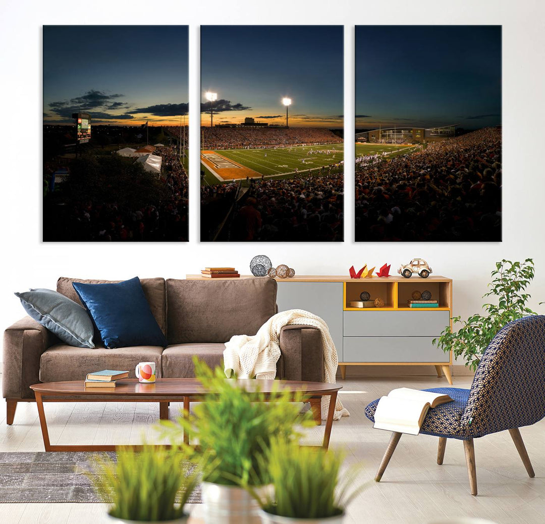 Ball State Cardinals Football Team Print - Muncie Scheumann Stadium Canvas featuring a sunset, floodlights, and lively crowd.