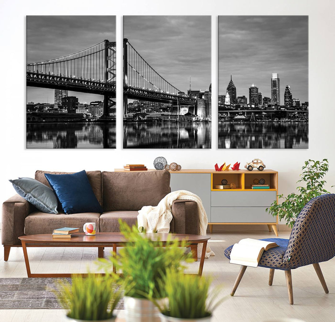 The "Large Wall Art Philadelphia Canvas Print" showcases a black-and-white depiction of the Ben Franklin Bridge with a water reflection.