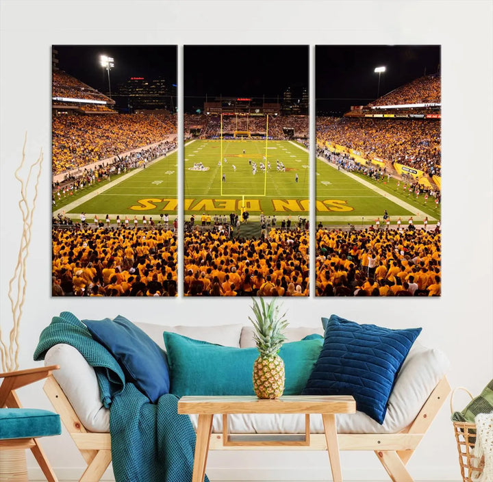 A living room boasts a gallery-quality finish with a large triptych featuring the ASU Sun Devils Football Team Print at Phoenix Mountain America Stadium wall art.