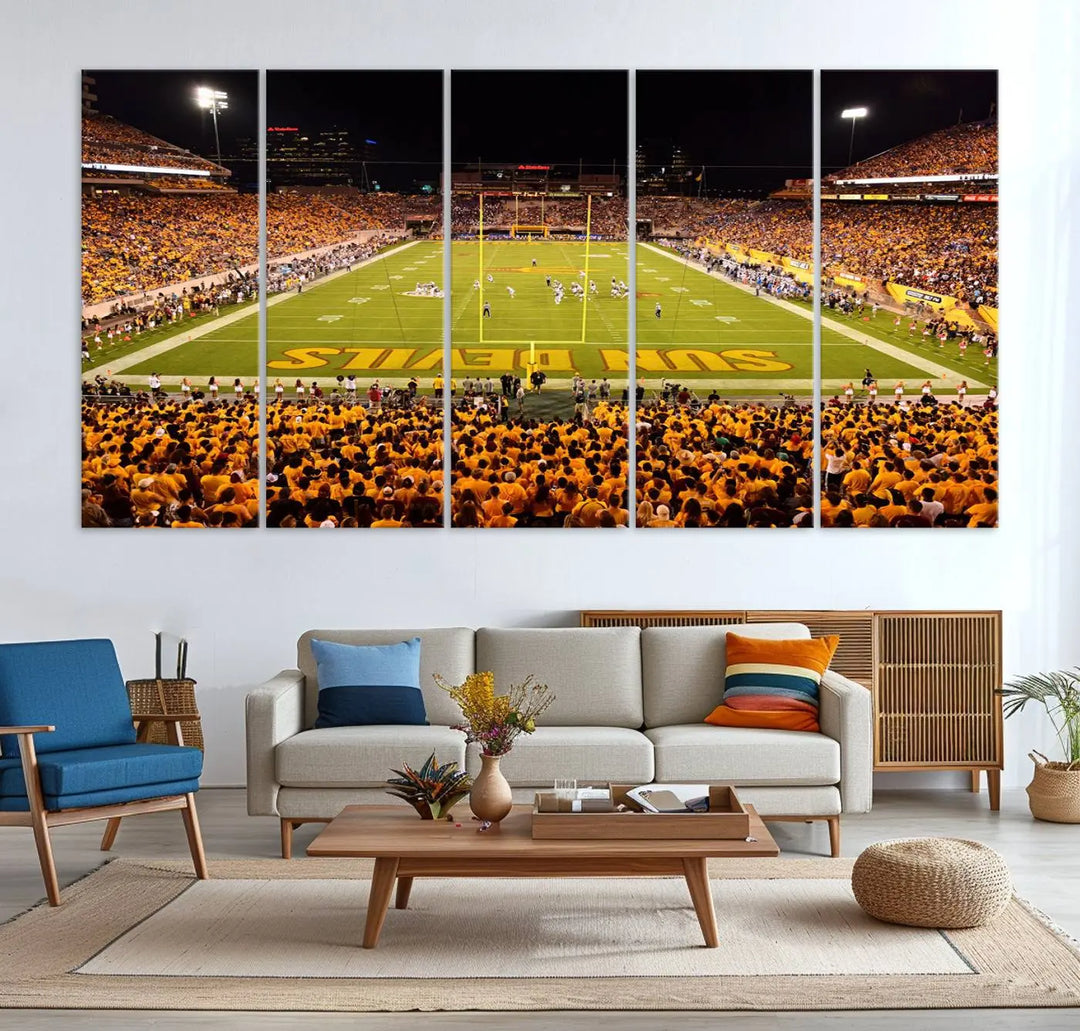 A living room boasts a gallery-quality finish with a large triptych featuring the ASU Sun Devils Football Team Print at Phoenix Mountain America Stadium wall art.