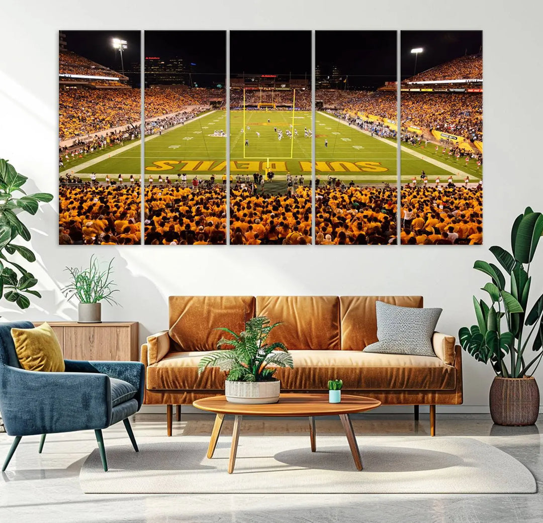 A living room boasts a gallery-quality finish with a large triptych featuring the ASU Sun Devils Football Team Print at Phoenix Mountain America Stadium wall art.