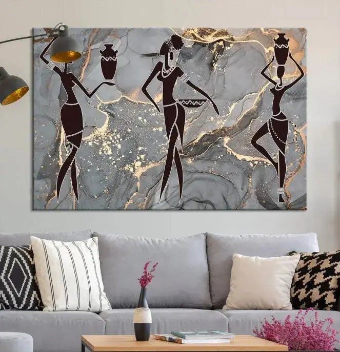 A canvas print titled "Abstract African Womens Art," with UV-protective coating, is displayed in three panels against a dark wall.