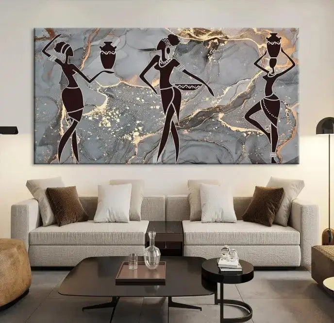 A canvas print titled "Abstract African Womens Art," with UV-protective coating, is displayed in three panels against a dark wall.