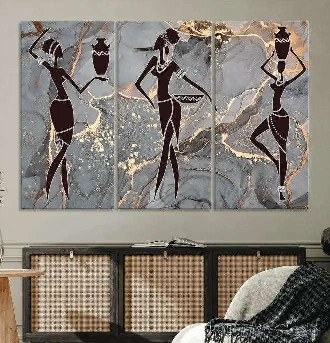 A canvas print titled "Abstract African Womens Art," with UV-protective coating, is displayed in three panels against a dark wall.