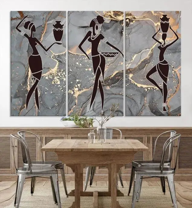 A canvas print titled "Abstract African Womens Art," with UV-protective coating, is displayed in three panels against a dark wall.