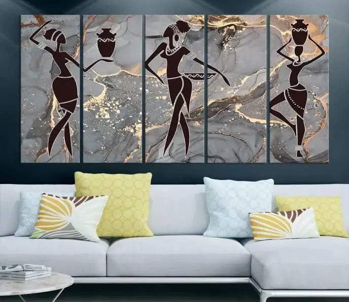 A canvas print titled "Abstract African Womens Art," with UV-protective coating, is displayed in three panels against a dark wall.