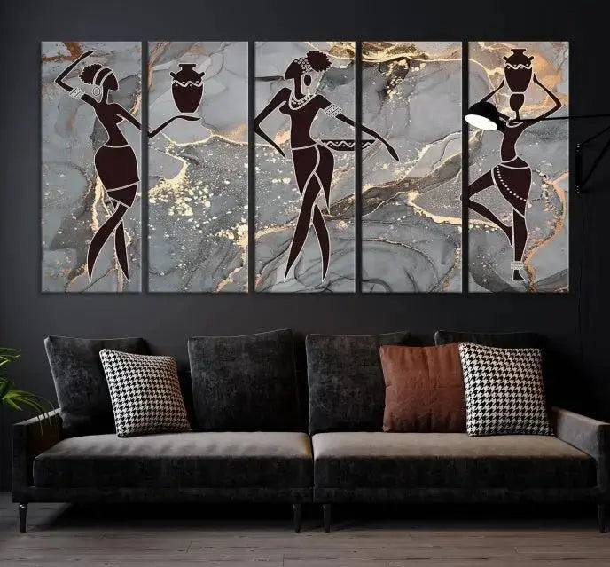 A canvas print titled "Abstract African Womens Art," with UV-protective coating, is displayed in three panels against a dark wall.