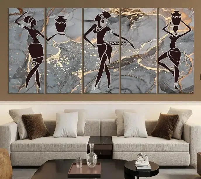 A canvas print titled "Abstract African Womens Art," with UV-protective coating, is displayed in three panels against a dark wall.