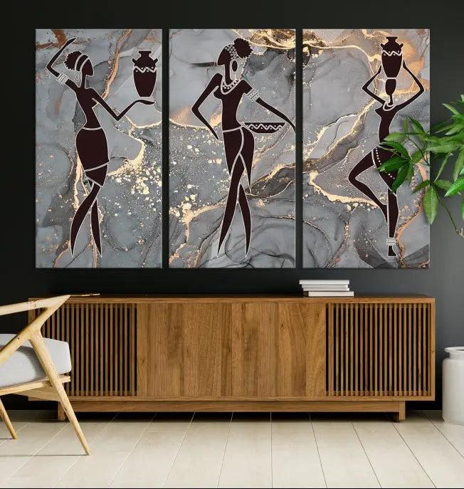 A canvas print titled "Abstract African Womens Art," with UV-protective coating, is displayed in three panels against a dark wall.