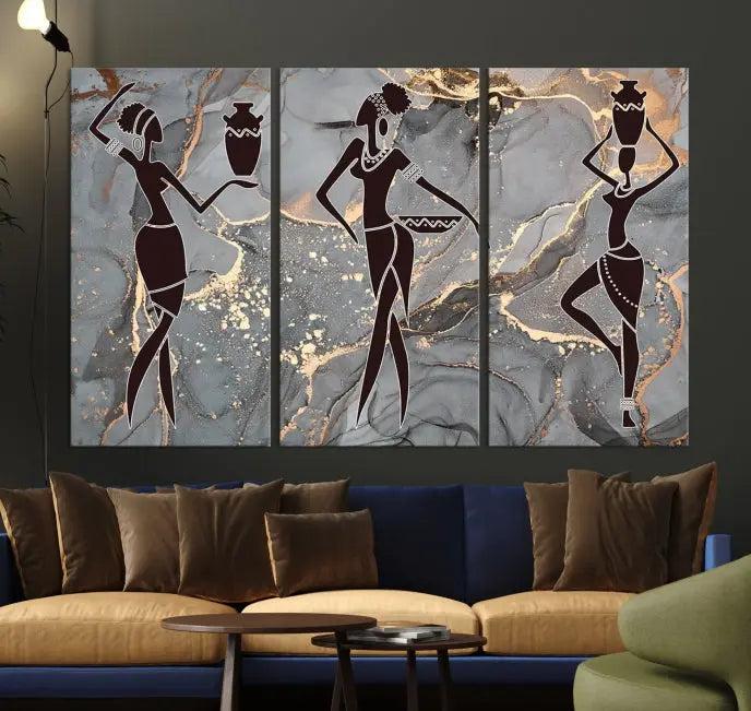 A canvas print titled "Abstract African Womens Art," with UV-protective coating, is displayed in three panels against a dark wall.