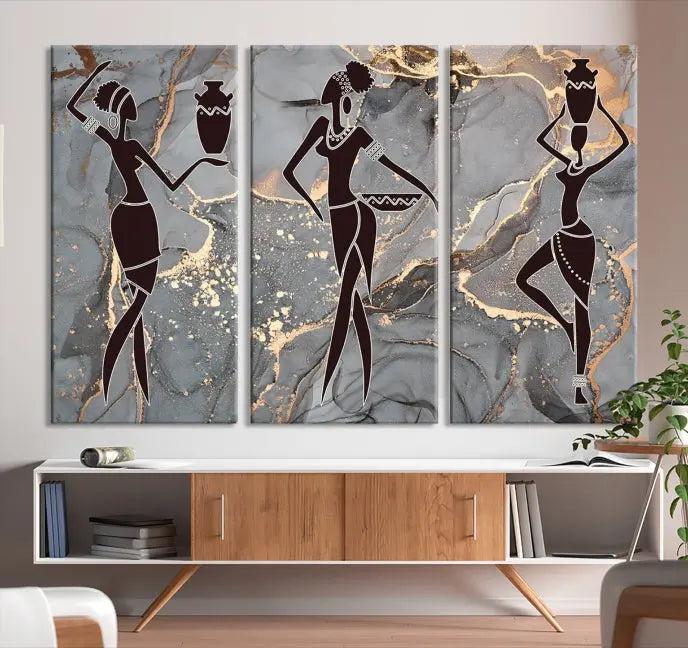 A canvas print titled "Abstract African Womens Art," with UV-protective coating, is displayed in three panels against a dark wall.