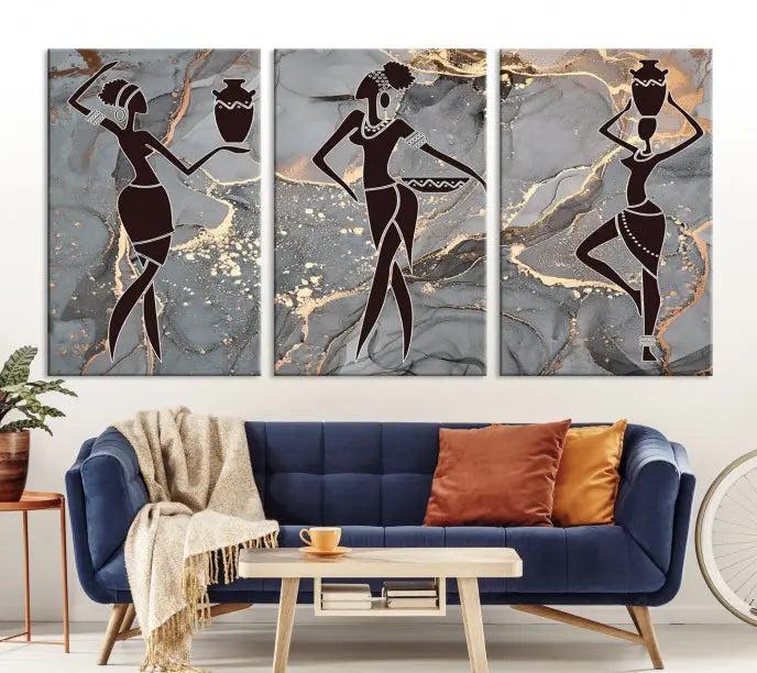 A canvas print titled "Abstract African Womens Art," with UV-protective coating, is displayed in three panels against a dark wall.