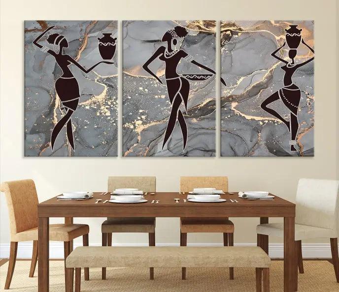 A canvas print titled "Abstract African Womens Art," with UV-protective coating, is displayed in three panels against a dark wall.