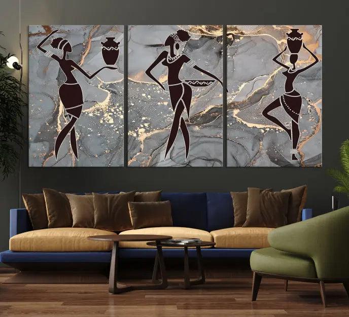 A canvas print titled "Abstract African Womens Art," with UV-protective coating, is displayed in three panels against a dark wall.