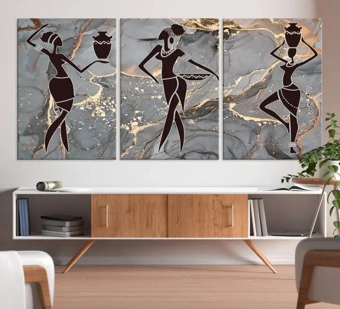 A canvas print titled "Abstract African Womens Art," with UV-protective coating, is displayed in three panels against a dark wall.