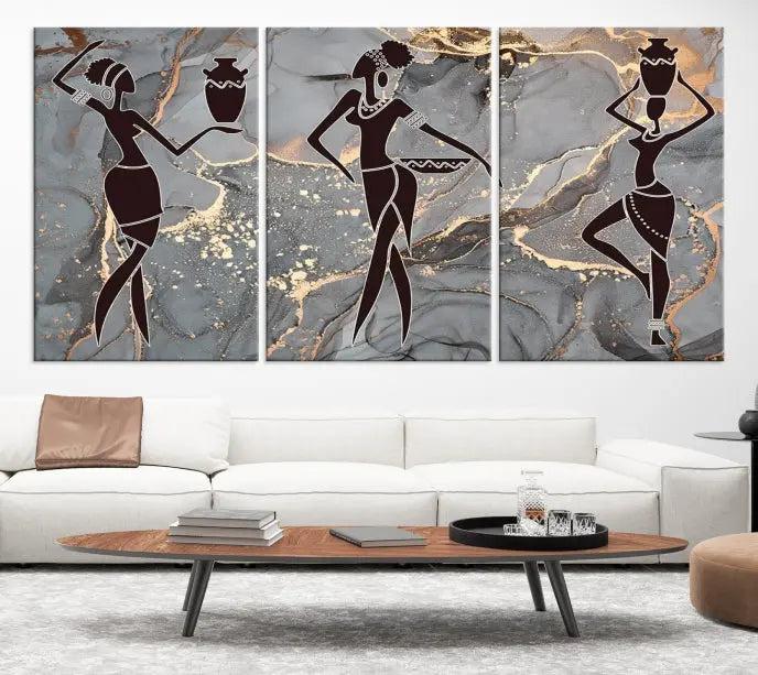 A canvas print titled "Abstract African Womens Art," with UV-protective coating, is displayed in three panels against a dark wall.