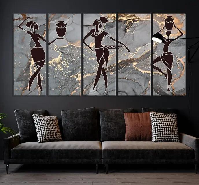 A canvas print titled "Abstract African Womens Art," with UV-protective coating, is displayed in three panels against a dark wall.