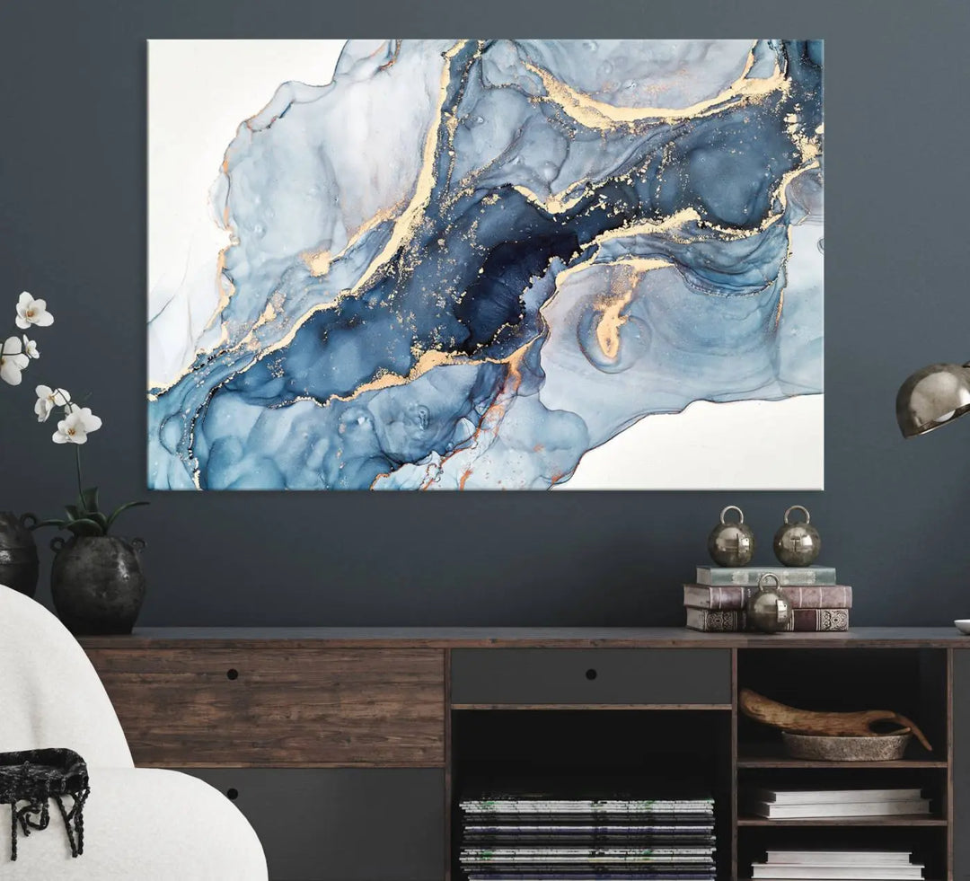 A contemporary setting showcases the "Abstract Art Print - Blue Abstract Canvas Wall Art Print Abstract Art Fluid Effect Marble Wall Art" on a dark wall.