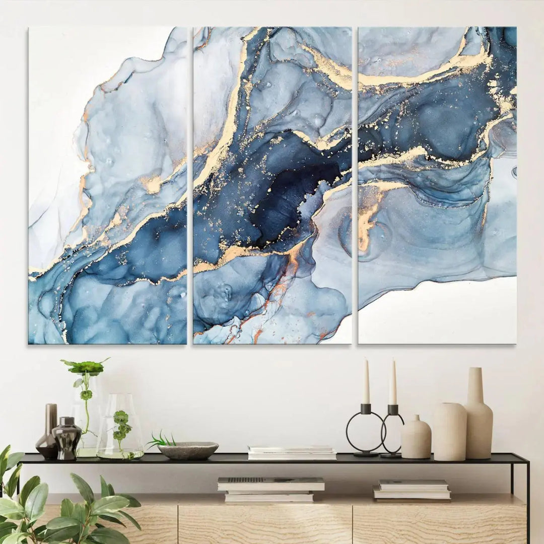 A contemporary setting showcases the "Abstract Art Print - Blue Abstract Canvas Wall Art Print Abstract Art Fluid Effect Marble Wall Art" on a dark wall.