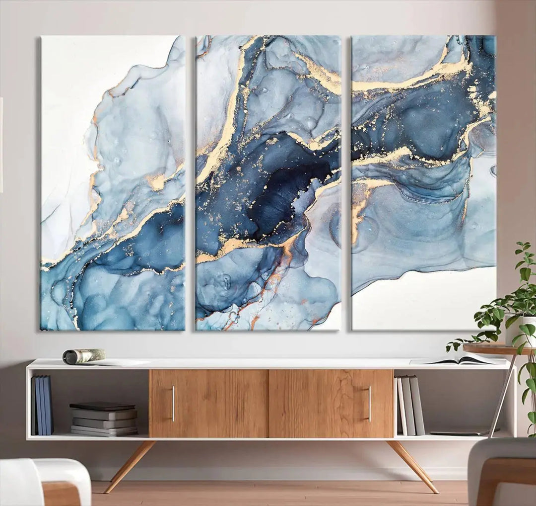 A contemporary setting showcases the "Abstract Art Print - Blue Abstract Canvas Wall Art Print Abstract Art Fluid Effect Marble Wall Art" on a dark wall.