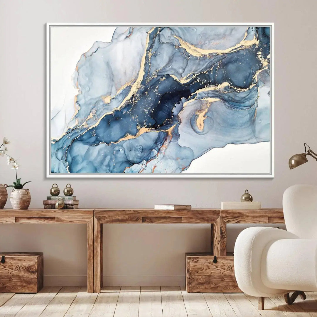 A contemporary setting showcases the "Abstract Art Print - Blue Abstract Canvas Wall Art Print Abstract Art Fluid Effect Marble Wall Art" on a dark wall.