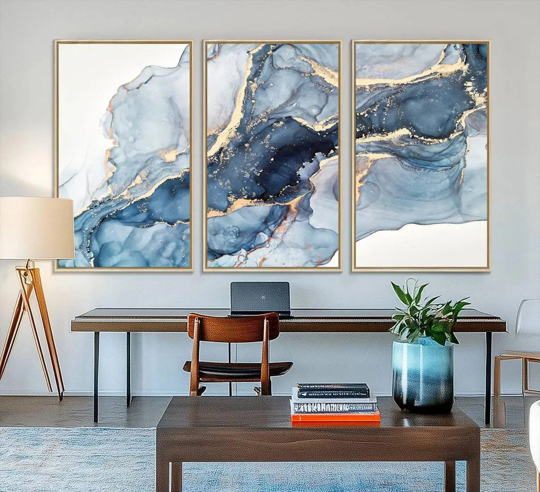 A contemporary setting showcases the "Abstract Art Print - Blue Abstract Canvas Wall Art Print Abstract Art Fluid Effect Marble Wall Art" on a dark wall.