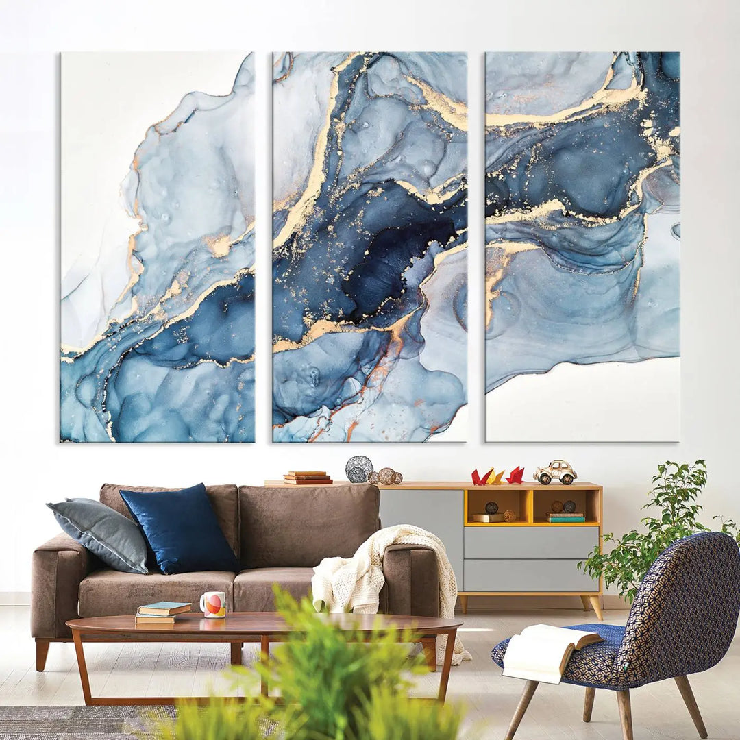 An abstract art print with fluid blue and gold hangs elegantly on the wall.