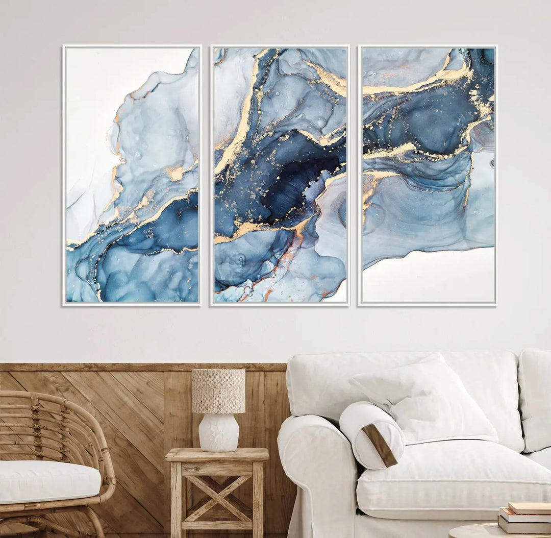 An abstract art print with fluid blue and gold hangs elegantly on the wall.