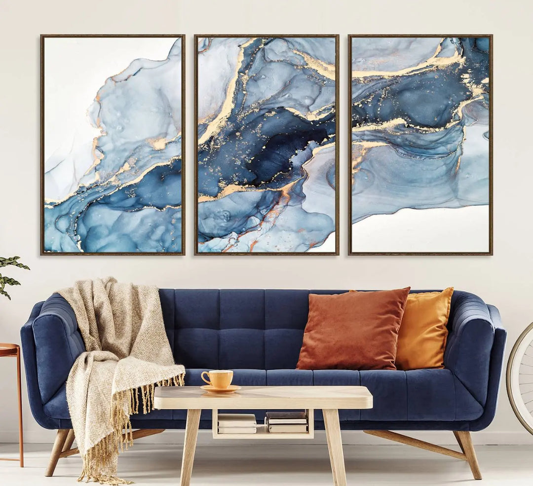 An abstract art print with fluid blue and gold hangs elegantly on the wall.