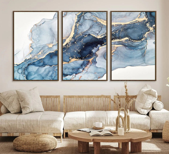 An abstract art print with fluid blue and gold hangs elegantly on the wall.