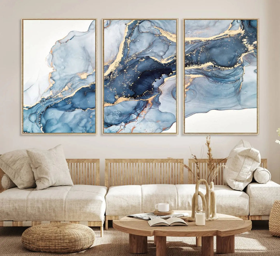 An abstract art print with fluid blue and gold hangs elegantly on the wall.