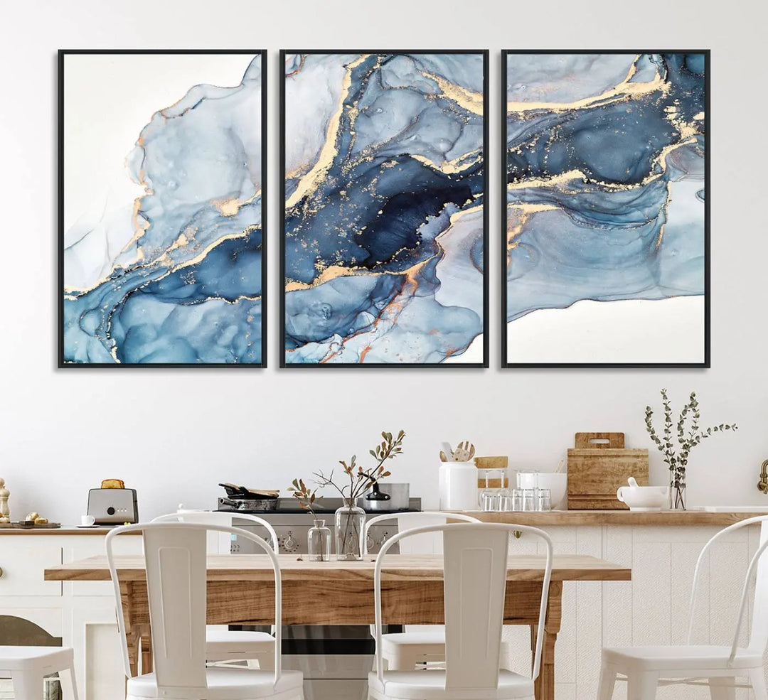 An abstract art print with fluid blue and gold hangs elegantly on the wall.