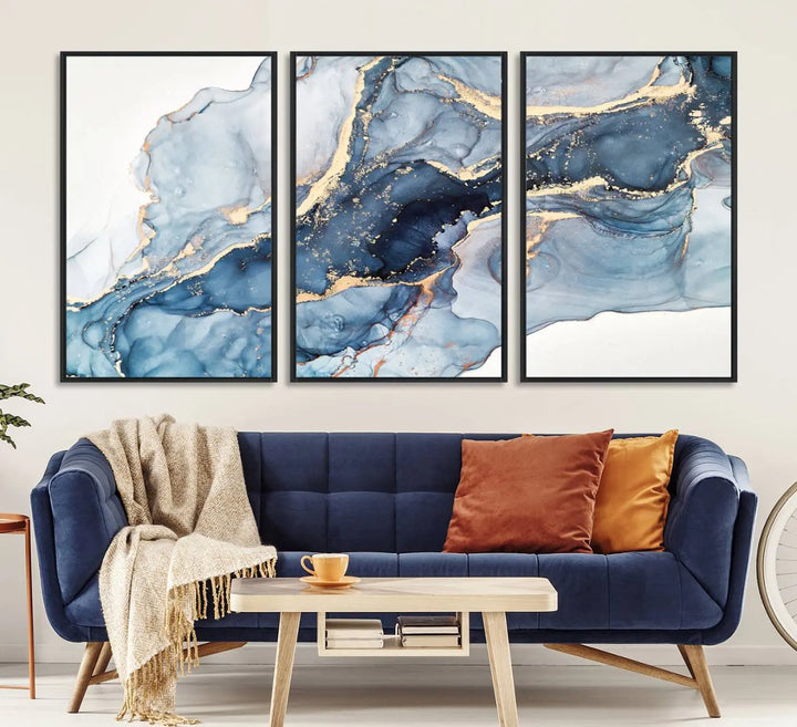 An abstract art print with fluid blue and gold hangs elegantly on the wall.