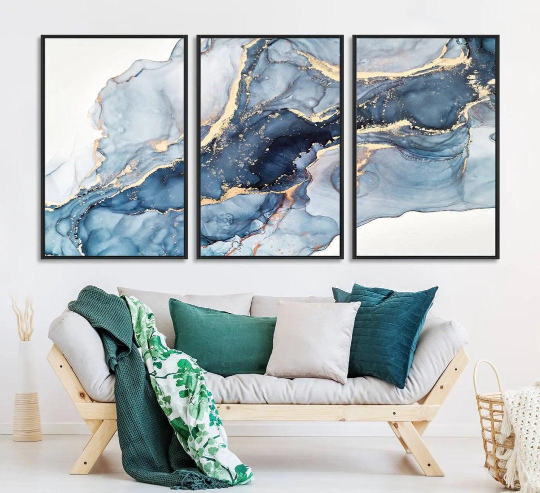 An abstract art print with fluid blue and gold hangs elegantly on the wall.