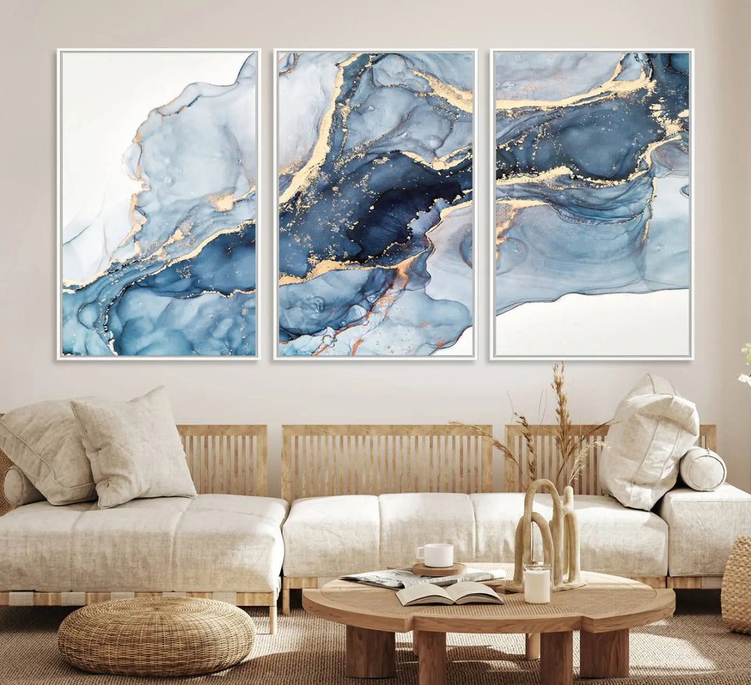 An abstract art print with fluid blue and gold hangs elegantly on the wall.