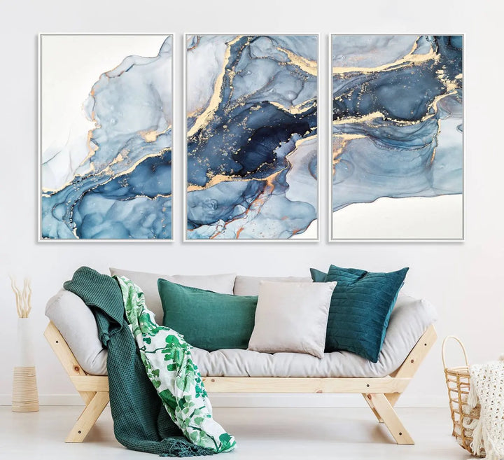 An abstract art print with fluid blue and gold hangs elegantly on the wall.