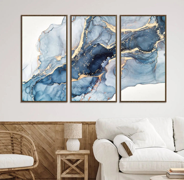 An abstract art print with fluid blue and gold hangs elegantly on the wall.