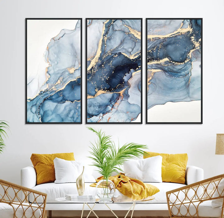 An abstract art print with fluid blue and gold hangs elegantly on the wall.