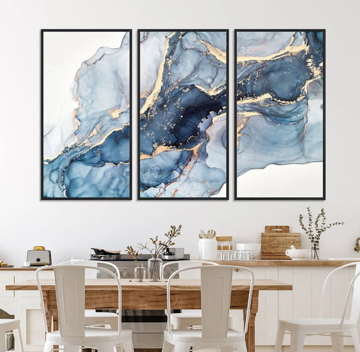 An abstract art print with fluid blue and gold hangs elegantly on the wall.