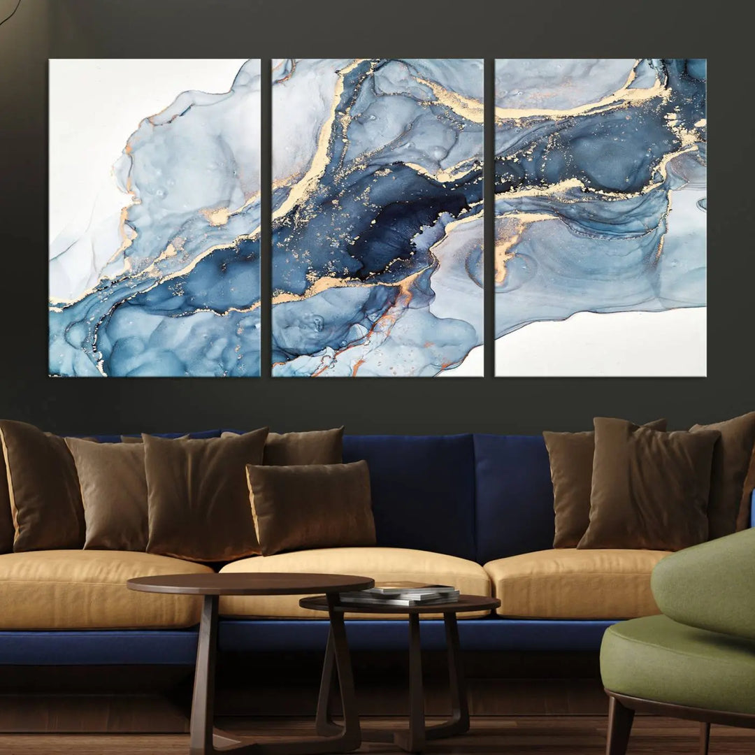 An abstract art print with fluid blue and gold hangs elegantly on the wall.